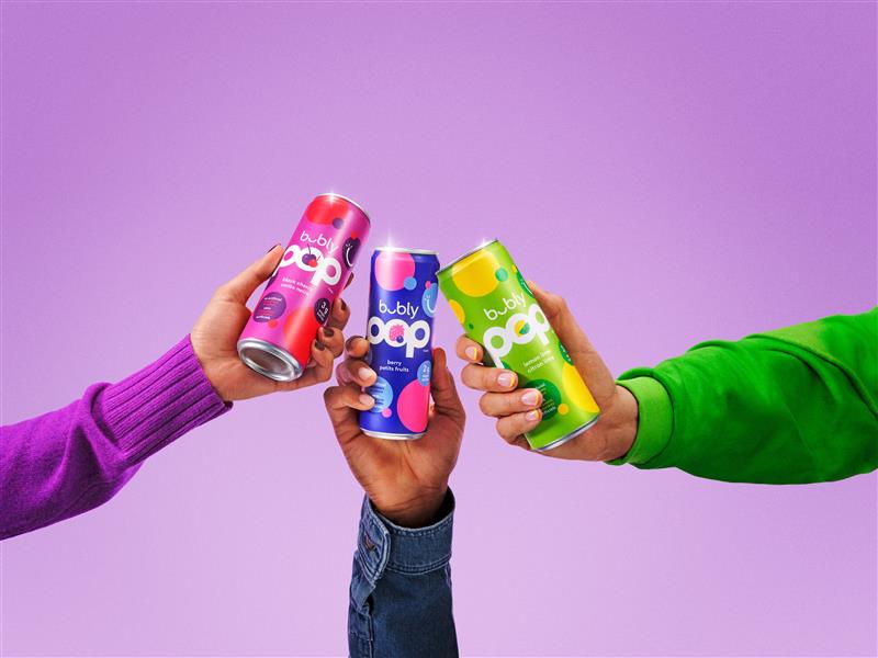 Three hands raising bubly™ POP sleek cans in berry, black cherry, and lemon lime flavours in a toast against a bright purple background, with each person wearing a colourful sleeve – purple, denim, and green.